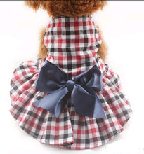 Load image into Gallery viewer, Red and Blue Checkered Dress adorned with a bow for your dog or cat.
